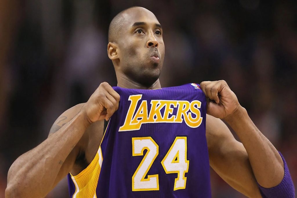 Kobe Bryant showing his number 24 jersey