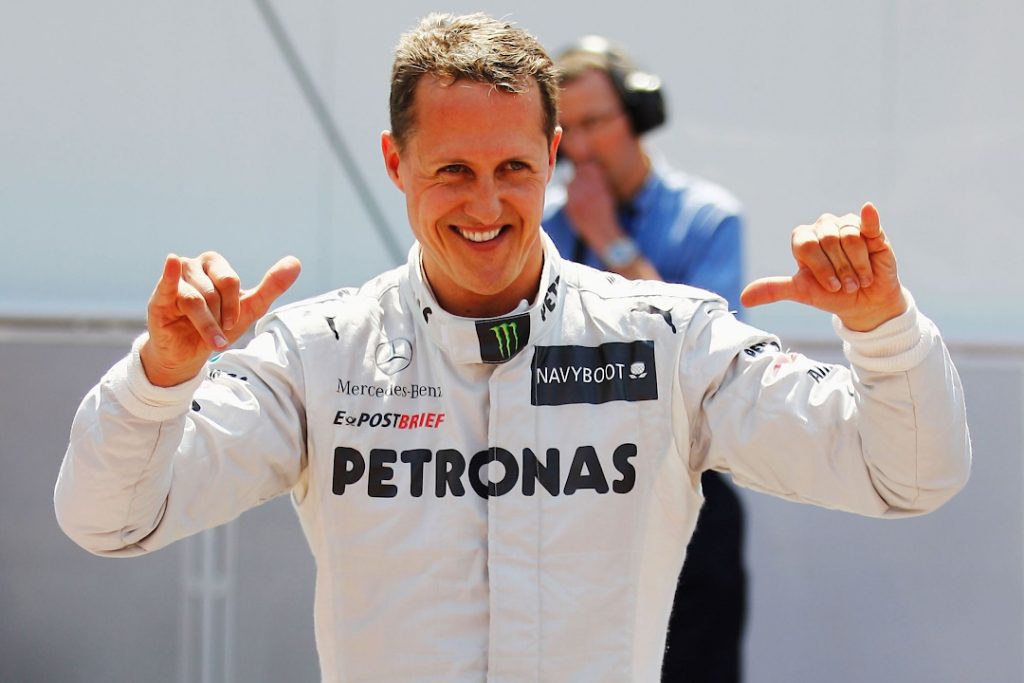 Michael Schumacher moviendo sus manos en celebración, para muchos mejor piloto Fórmula 1 de todos los tiempos.