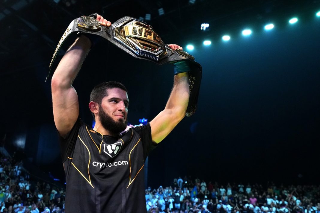 Islam Makhachev holding the title